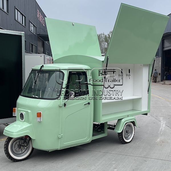 light green piaggio ape food truck