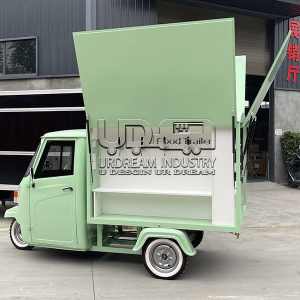 light green piaggio ape food truck